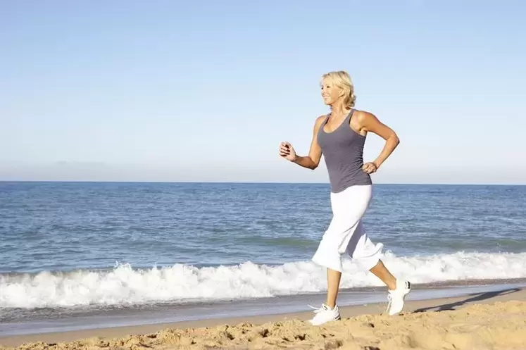 An elderly woman is jogging for weight loss and good heart function